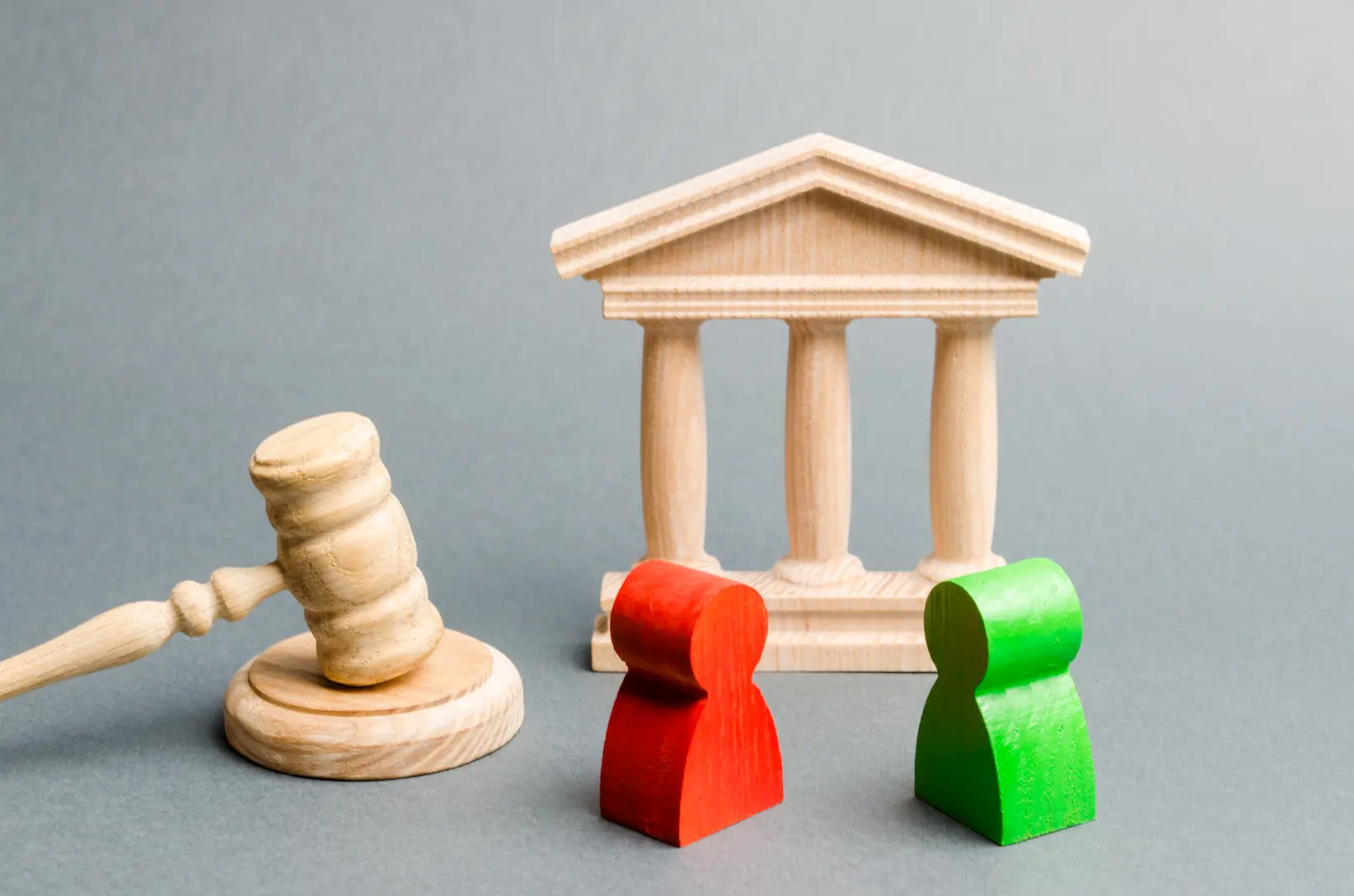 wooden-figures-of-people-standing-near-the-judge-2025-03-18-18-46-03-utc